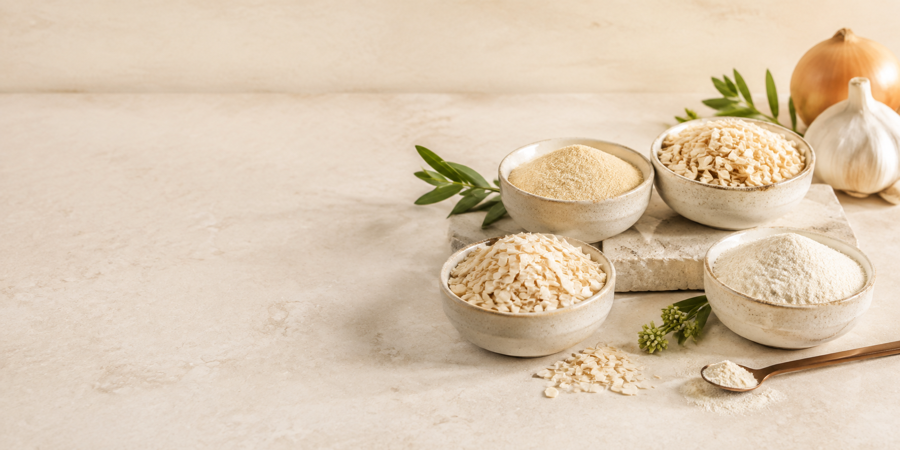 Dehydrated garlic and onion flakes and powders in ceramic bowls